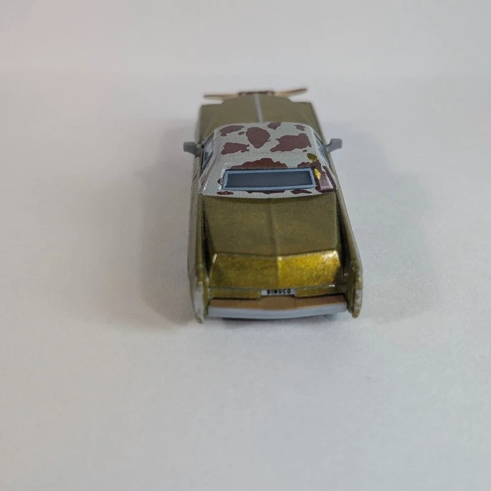 Disney Pixar Cars Tex Dinoco Gold Cadillac Diecast Toy Car Longhorns Mattel